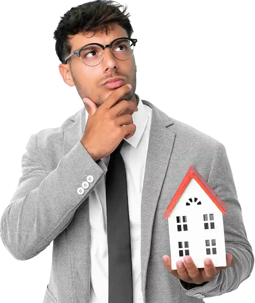 business man holding house isolated blue background having doubts 1 11zon